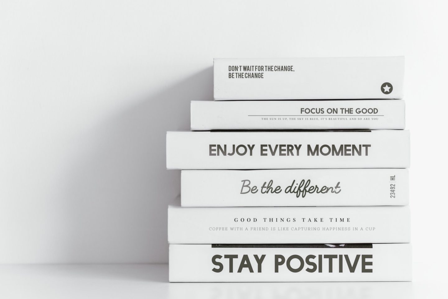minimal books background aesthetic positive quotes in white e1653361642997